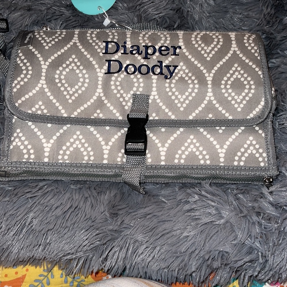 Initials, Inc.  Portable diaper changing pad.  Super cute and so functional